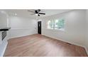 Bright open living room with wood floors, fireplace, and a view to the front yard at 2610 Knoll Se Rd, Smyrna, GA 30080