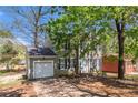 Charming two-story home featuring a manicured lawn, attached garage, and traditional architectural details at 3742 Linecrest Rd, Ellenwood, GA 30294