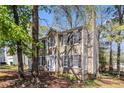 Charming two-story home featuring a manicured lawn, attached garage, and traditional architectural details at 3742 Linecrest Rd, Ellenwood, GA 30294
