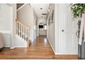Inviting entryway featuring hardwood floors, neutral paint, staircase, and ample natural light at 4735 Longcourt Se Dr, Atlanta, GA 30339