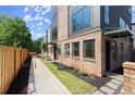 Brick home exterior showcasing landscaping, a walkway, and sleek modern design at 1123 W Marietta St, Atlanta, GA 30318