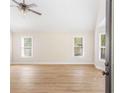Spacious living room with hardwood flooring, large windows, and an open layout perfect for entertaining at 639 Ladora Dr, Dallas, GA 30157
