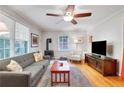 Comfortable living room with hardwood floors, ample seating, and entertainment center at 108 Glenn St, Decatur, GA 30030