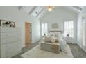 Bright main bedroom with vaulted ceilings, white accents, and french doors at 206 Mountain Vista Blvd, Canton, GA 30115