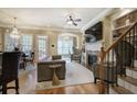 Bright living room with fireplace, hardwood floors, and elegant chandelier lighting at 636 Parkside Village Nw Way, Marietta, GA 30060