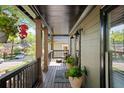 Inviting front porch with stylish decor, potted plants, and comfortable seating area at 1168 Eggleston Sw St, Atlanta, GA 30310