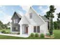 Stunning two-story house with white siding, modern windows, and well-maintained landscaping at 6565 Rhett Run, Cumming, GA 30028
