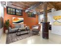 Cozy living space featuring exposed brick, wooden ceiling, and comfortable seating, perfect for relaxation and unwinding at 170 Boulevard Se # E006, Atlanta, GA 30312