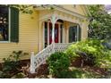 Inviting entrance with red door, white porch, and lush landscaping at 218 Barry St, Decatur, GA 30030