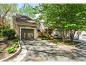 Lovely townhome with a private driveway, garage and beautifully landscaped entrance at 3188 Paces Mill Se Rd, Atlanta, GA 30339