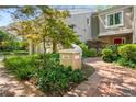 Beautiful townhome exterior with lush landscaping, brick path and private front entry at 3188 Paces Mill Se Rd, Atlanta, GA 30339