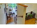 View of the living room from the staircase showing seating and balcony access at 145 15Th Ne St # 1015, Atlanta, GA 30309