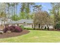 Beautiful home with landscaped front yard and charming architectural details at 3038 Nancy Creek Nw Rd, Atlanta, GA 30327