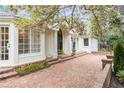Attractive house exterior with brick walkway leading to a charming entryway at 3038 Nancy Creek Nw Rd, Atlanta, GA 30327