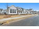 Beautiful white two-story home with manicured front yard and sidewalk in a well-kept neighborhood at 535 Pearl St, Cumming, GA 30040