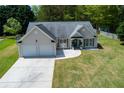 Well-maintained home with a lush front lawn, tidy landscaping, and a spacious driveway at 101 Javay Ct Ct, Villa Rica, GA 30180