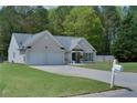 Lovely home showcasing a neat lawn, charming curb appeal, and an attached two-car garage at 101 Javay Ct Ct, Villa Rica, GA 30180