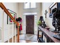 Inviting foyer with hardwood floors and stylish decor leading into the home at 1015 Heatherbrooke Ln, Atlanta, GA 30324