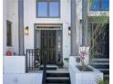 Elegant home entrance featuring classic architecture and well-maintained landscaping at 1015 Heatherbrooke Ln, Atlanta, GA 30324
