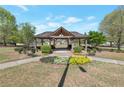 Outdoor gazebo in a beautiful setting with landscaping at 310 Oak Leaf Pl, Acworth, GA 30102