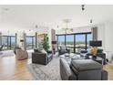 Spacious living room with ample seating, city views from large windows, and contemporary decor at 3475 Oak Valley Ne Rd # 1720, Atlanta, GA 30326