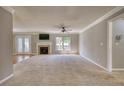 Bright living room with a cozy fireplace and access to the outside through glass paneled doors at 72 Grayson New Hope Rd, Grayson, GA 30017