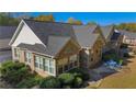 Rear exterior view of home, showcasing its brick facade, windows, and well-maintained landscaping at 4573 Caleb Xing # 20, Powder Springs, GA 30127