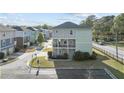 Two-story house showcasing a charming exterior with dual porches and well-maintained landscaping at 725 Mcwilliams Se Rd, Atlanta, GA 30315