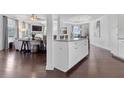 Elegant living room area with white island, hardwood floors and open concept at 725 Mcwilliams Se Rd, Atlanta, GA 30315