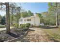 Exterior angle shot of home with porch, landscaping, and lawn at 278 Benjamin Dr, Rockmart, GA 30153