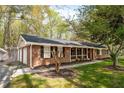 Beautiful brick home with attached garage and manicured front yard at 4220 Smith Rd, Loganville, GA 30052