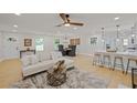 Spacious living room featuring an open floor plan, modern decor, and ample natural light at 1830 Mayfield Rd, Alpharetta, GA 30009