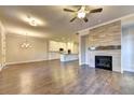 Bright and airy living room with a fireplace, hardwood floors, and recessed lighting at 504 Otwell Ave, Cumming, GA 30040