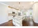 Modern kitchen featuring granite countertops, stainless steel appliances, and a large kitchen island at 1026 Township Sq, Alpharetta, GA 30022