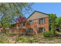 Brick apartment building featuring shuttered windows and a well-maintained lawn at 3105 Colonial Way # F, Atlanta, GA 30341