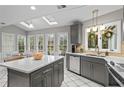 Bright kitchen with stainless steel appliances, skylights, an island, gray cabinets, and plenty of counter space at 5663 Brookstone Nw Dr, Acworth, GA 30101