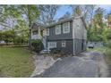 Split-level home featuring a driveway and gray-painted brick foundation at 196 Wadley Nw St, Atlanta, GA 30314