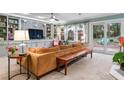 Inviting living room featuring built-in shelving, a ceiling fan, and a sliding glass door at 1998 Jordan Terrace Ne, Atlanta, GA 30345