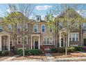 Inviting townhome exterior with lush greenery and well-maintained facade, creating a welcoming curb appeal at 4899 Seldon Se Way, Smyrna, GA 30080