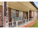 Inviting front porch adorned with vintage railings and comfortable seating, perfect for relaxing outdoors at 2044 Yucca Dr, Decatur, GA 30032