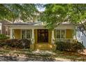 Charming home featuring a classic front porch, brick facade, and manicured landscaping at 334 Sutherland Ne Pl, Atlanta, GA 30307