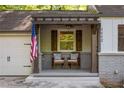 Inviting front porch with seating area and charming architectural details at 1002 Forrest Blvd, Decatur, GA 30030