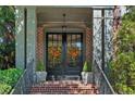 Inviting front entrance features brick accents, decorative wreaths, and lush greenery at 3127 Lenox Ne Rd # 20, Atlanta, GA 30324