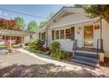 Charming one-story home featuring a covered carport, painted brick, and a well-manicured front yard at 2469 Hunting Valley Dr, Decatur, GA 30033