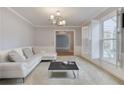 Bright living room with white sofa, shutters, and neutral decor at 2636 Harvest Se Dr, Conyers, GA 30013
