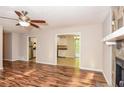 Open-concept living area with hardwood floors, flowing into the dining and kitchen spaces at 3790 Willow Ridge Rd, Douglasville, GA 30135