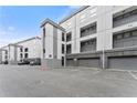 Modern apartment complex with attached garages and ample parking spaces in front at 747 Ralph Mcgill Ne Blvd # 223, Atlanta, GA 30312