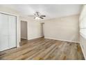 Spacious living room with stylish wood floors, ample natural light, and a modern ceiling fan at 1667 Hollyhock Ter, Decatur, GA 30032
