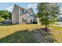 Well-maintained side yard, with green grass and a partial view of the home's exterior at 7431 St David St, Fairburn, GA 30213