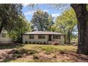 Charming single-story home featuring a well-maintained lawn and mature trees at 1089 Greenleaf Se Rd, Atlanta, GA 30316
